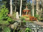 60" Love Seat in the garden with a gazebo