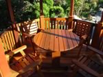 Round Patio Table with Club Chairs in a Gazebo