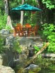 Table, chairs and umbrella on outdoor patio